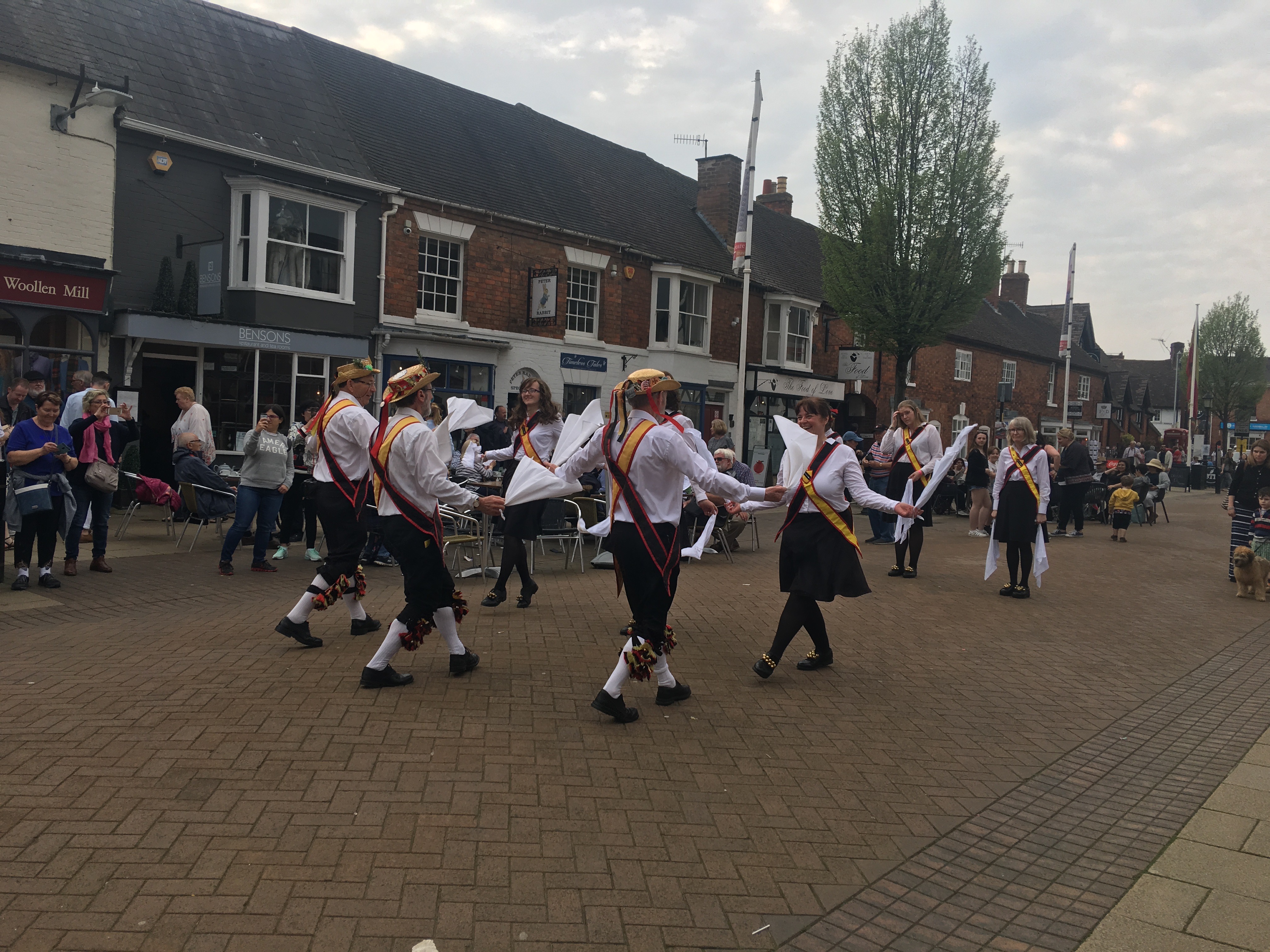 alt="Morris dancers dancing in two lines performing a traditional Renaissance dance on Shakespeare's birthday"